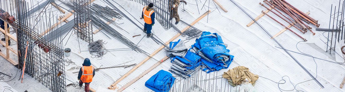 Winter Gear, Curing Blankets - Two Construction Workers Using Curing Blankets